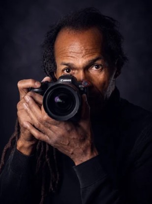 Karl Mullings behind his camera